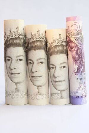 Rolled British five, ten and twenty pound notes standing on their endsの写真素材
