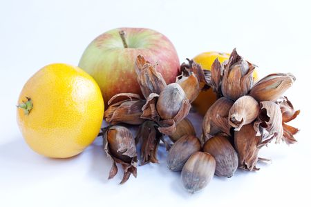 Apple, satsuma and cobb nuts isolated over a white backgroundの写真素材