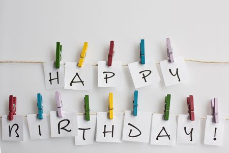 Letters on a washing line spelling out happy birthdayの写真素材