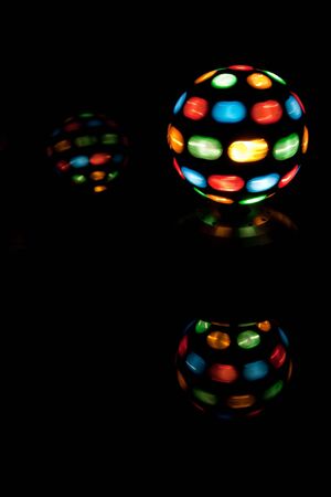 A lit disco ball & reflectionsの写真素材