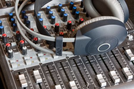 A sound mixing desk with a pair of headphonesの写真素材