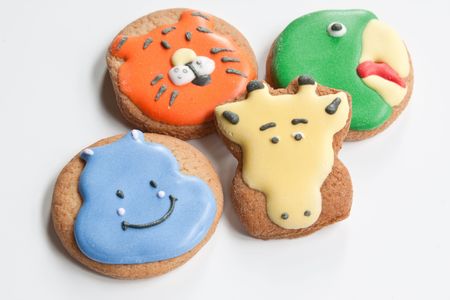 Cookies decorated with a hippopotamus, tiger, giraffe & parrotの写真素材