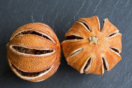 A pair of dried oranges, decoratively sliced for use as pot pourri