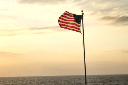 American flag overlooking the water