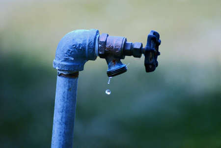 Blue Leaking Outdoor Faucet