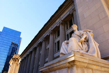 Outside of the courthouse and post office building in downtown Indianapolis, IN with a statue in the foreground.の写真素材