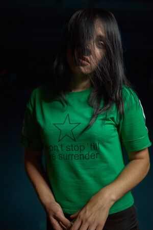 Girl posing in night on the parking of trading centerの写真素材