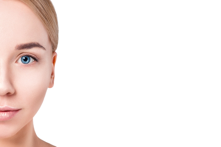 Woman beautiful face portrait. Beauty Portrait. Beautiful Spa model Girl with Perfect Fresh Clean Skin. Blonde female looking at camera. Youth and Skin Care Concept.の写真素材