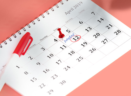 Concept image of calendar with blue pin and gold coins. 3D Render Illustration isometric calendar of 12 april payday or payroll. Pinned day, closeup.の写真素材