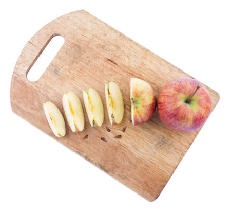 Cut apple on a cutting boardの写真素材