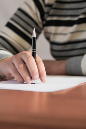 Close up of human hand with penの写真素材