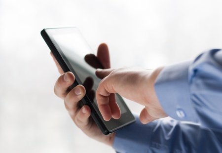 A man holding a tablet pcの写真素材