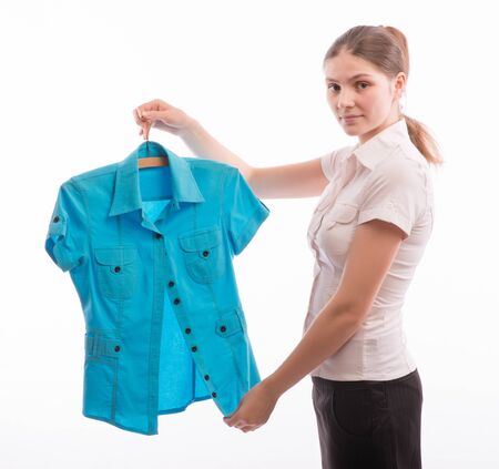 Businesswoman chooses a new outfitの写真素材