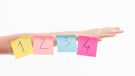 A woman with a piece of paper on handの写真素材