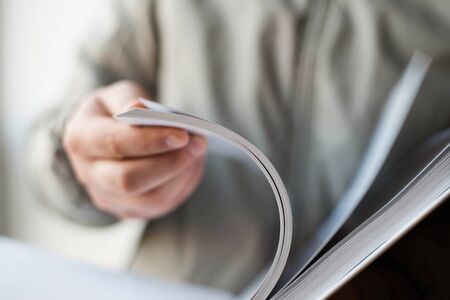 Businessman uses a bookの写真素材