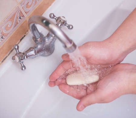 man washing his hands