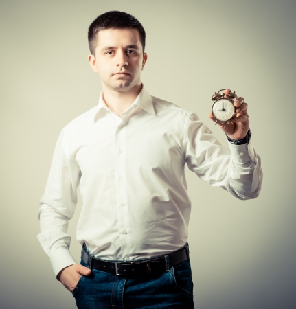 Alarm clock on businessman's hand, Time over conceptの写真素材