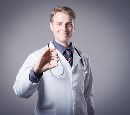 young doctor holding a pillの写真素材