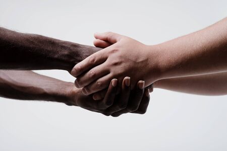 African American businessman shaking hands with caucasian businessmanの写真素材
