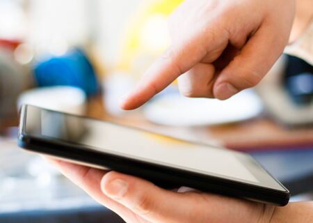 Hands with tablet computerの写真素材