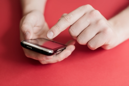 man uses a mobile phoneの写真素材