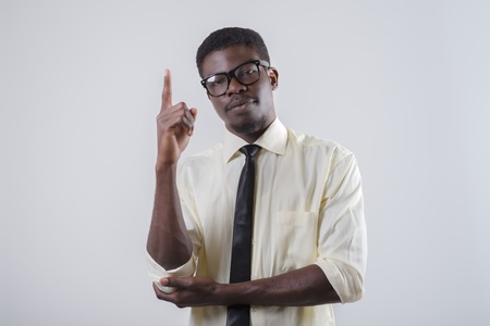 African-American young man points his index fingerの写真素材