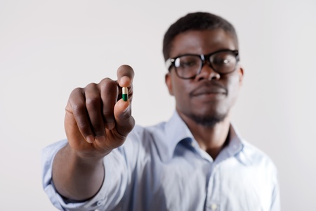 African-American man holding pillsの写真素材