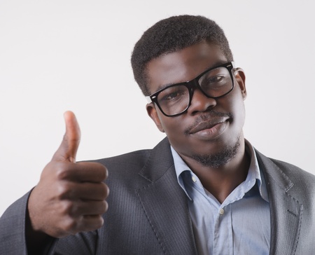 African-American man holding his thumb up