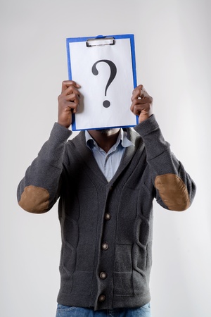 African-American man holding a question markの写真素材