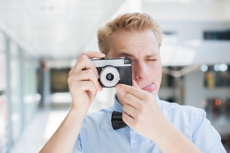 stylish man with a cameraの写真素材