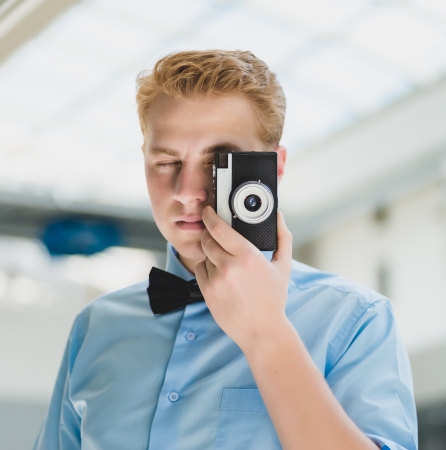 stylish man with a cameraの写真素材