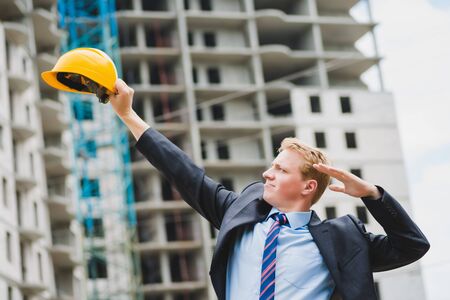 Young successful engineer in a helmetの写真素材
