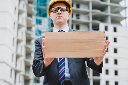 engineer holding a poster, poster