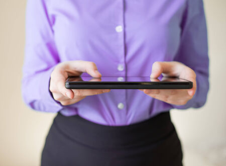 woman uses a digital tablet. Modern gadget in hand.