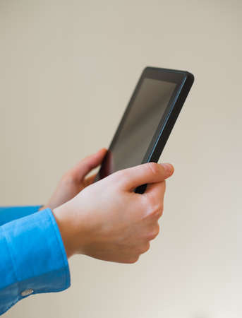 woman uses a digital tablet. Modern gadget in hand.