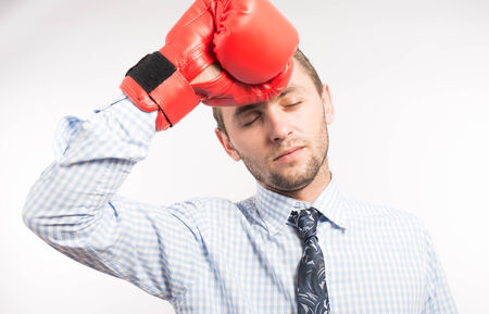Young businessman with boxing gloves