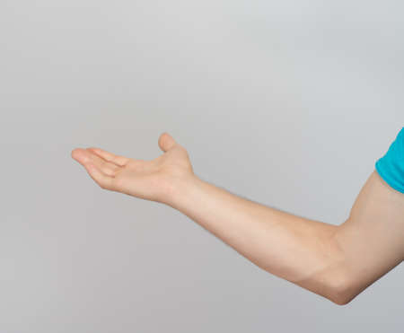 man pointing at something interesting over white backgroundの写真素材