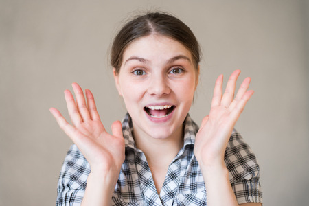 Close-up of a young woman looking surprisedの写真素材
