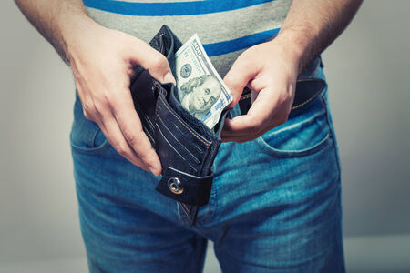 Man gets $ 100 from her purseの写真素材
