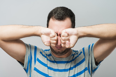 Man covering his hearsの写真素材