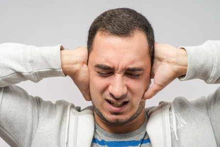 Man covering his hearsの写真素材