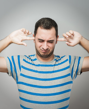Man covering his hearsの写真素材