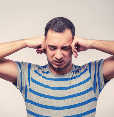 Man covering his hearsの写真素材
