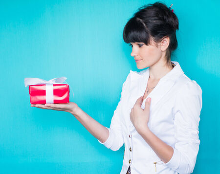 Young woman portrait hold gift.の写真素材