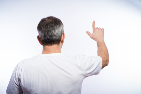 businessman in formal wear pushing forefinger screenの写真素材