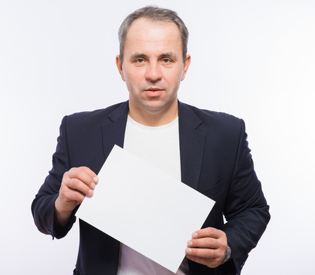 Businessman showing the big blank card in handの写真素材