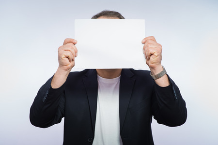 Businessman showing the big blank card in handの写真素材