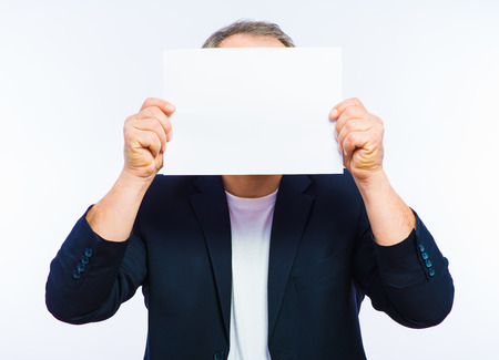 Businessman showing the big blank card in handの写真素材