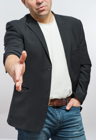 Businessman offering for handshake over white background. Copy space.の写真素材
