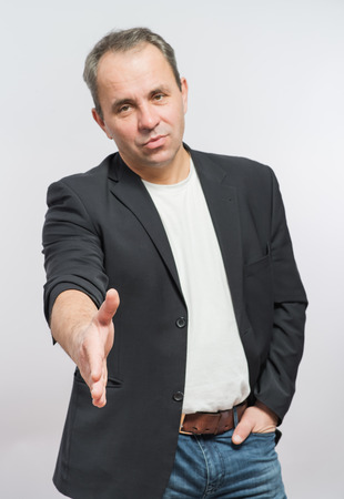 Businessman offering for handshake over white background. Copy space.の写真素材